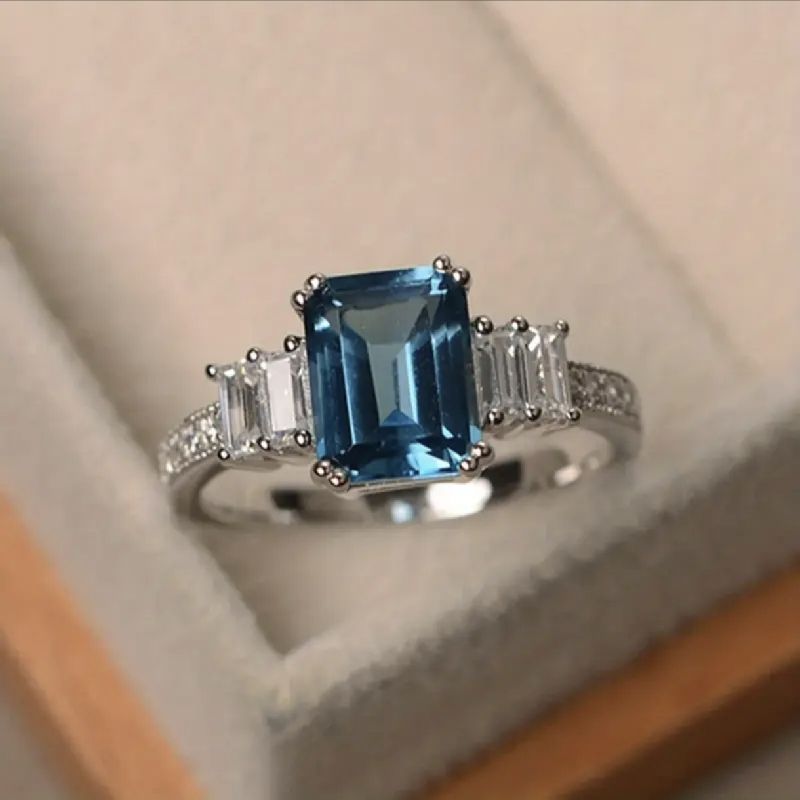 ANILLO PLATEADO CON PIEDRA AGUA MARINA DE ALEACIONES TALLA 6