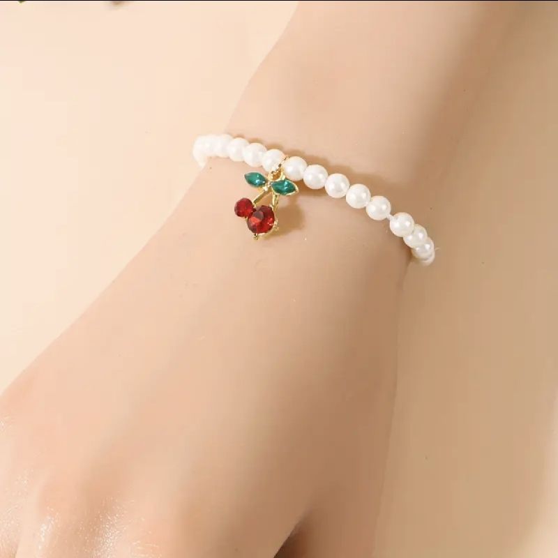 PULSERA CUENTAS CON COLGANTE CEREZA