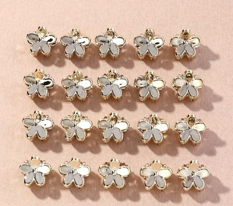 PINZAS FLOR PLATEADAS