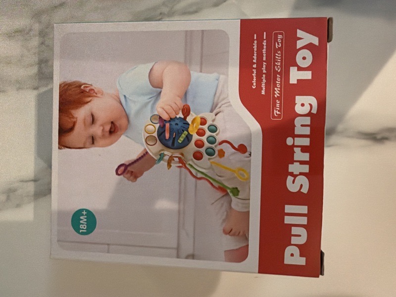 pull string toy sensorial Rojo